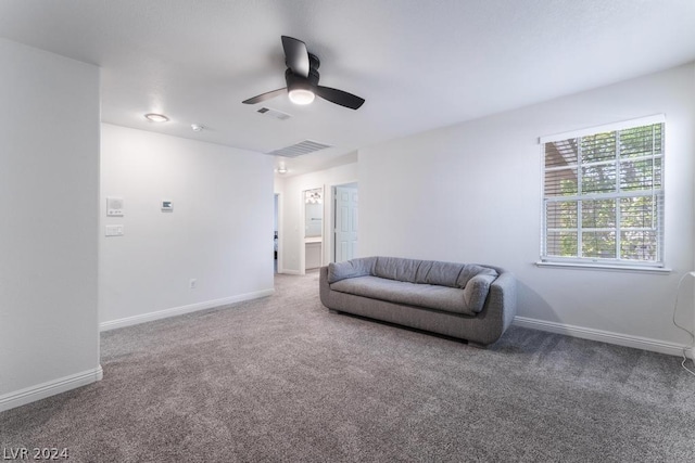 sitting room featuring ceiling fan and carpet flooring