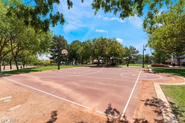 view of basketball court featuring a yard