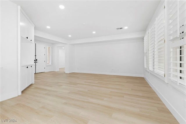 spare room with light hardwood / wood-style flooring