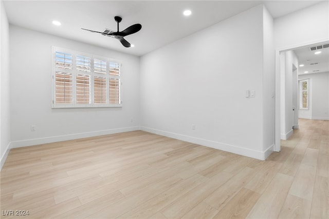 unfurnished room with ceiling fan, a healthy amount of sunlight, and light hardwood / wood-style flooring