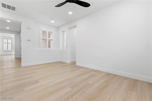 unfurnished room featuring ceiling fan, a healthy amount of sunlight, and light hardwood / wood-style flooring