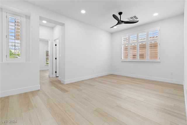 empty room with light hardwood / wood-style floors and ceiling fan