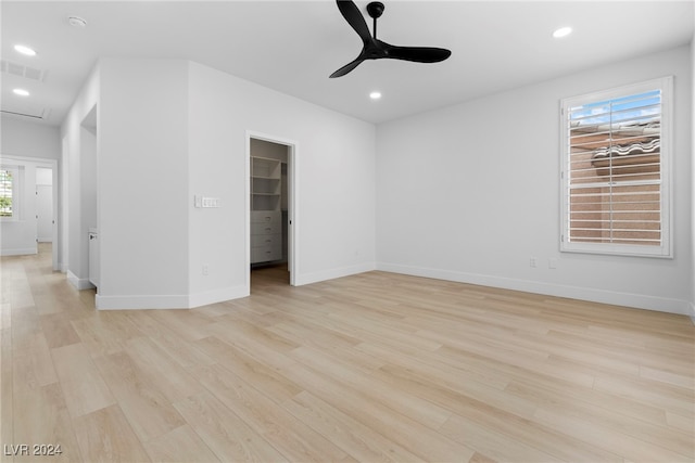 spare room with ceiling fan and light hardwood / wood-style floors