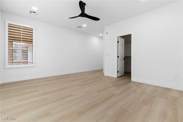 unfurnished room with light hardwood / wood-style floors and ceiling fan