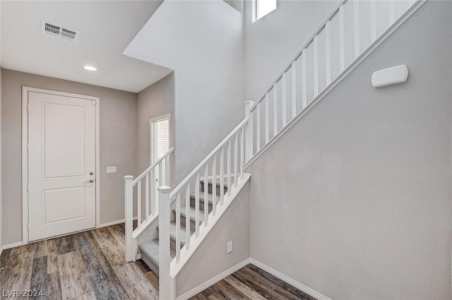 stairway with wood-type flooring