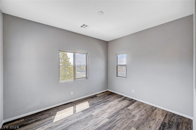 empty room featuring hardwood / wood-style flooring