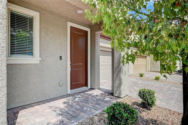 property entrance featuring a garage