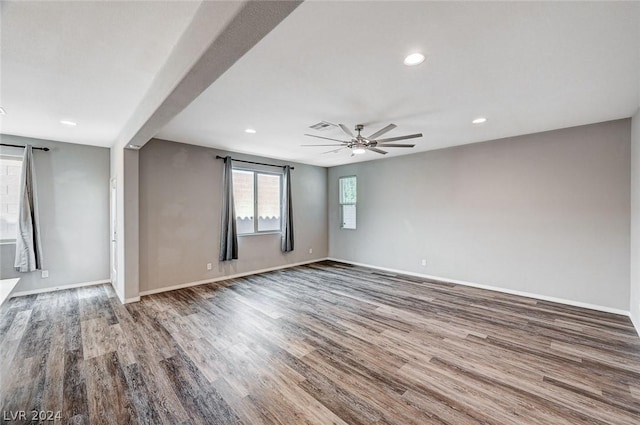 empty room with hardwood / wood-style flooring and ceiling fan