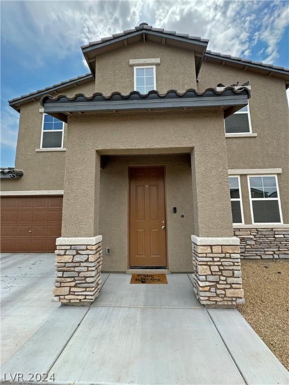 entrance to property featuring a garage