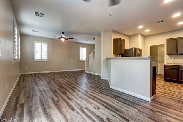 kitchen featuring stainless steel refrigerator, ceiling fan, and hardwood / wood-style floors