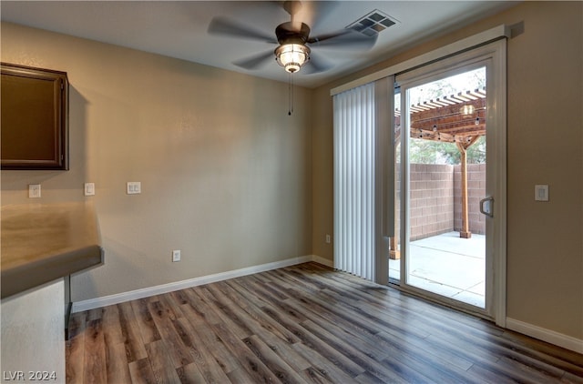 unfurnished dining area with wood-type flooring and ceiling fan