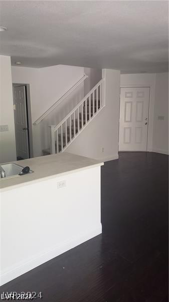 staircase with hardwood / wood-style flooring