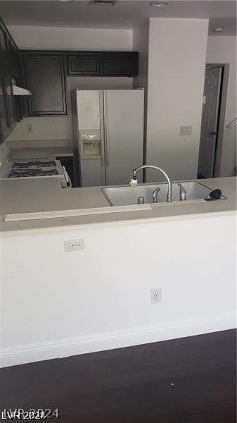 kitchen with sink and white appliances