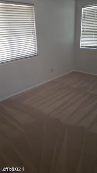 unfurnished room with carpet flooring