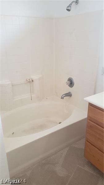 bathroom with bathtub / shower combination and vanity