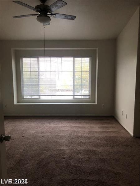 carpeted empty room with ceiling fan