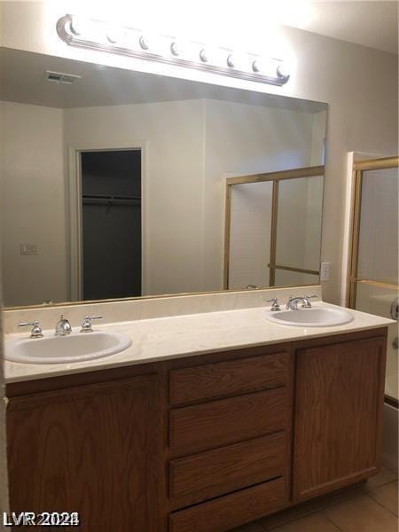 bathroom featuring tile patterned floors, vanity, and independent shower and bath