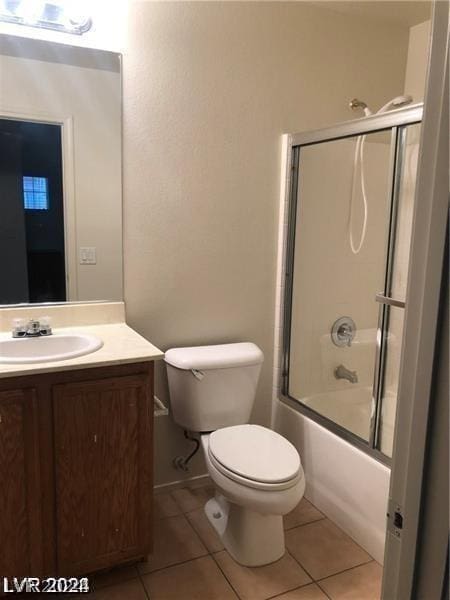 full bathroom with toilet, vanity, tile patterned flooring, and shower / bath combination with glass door