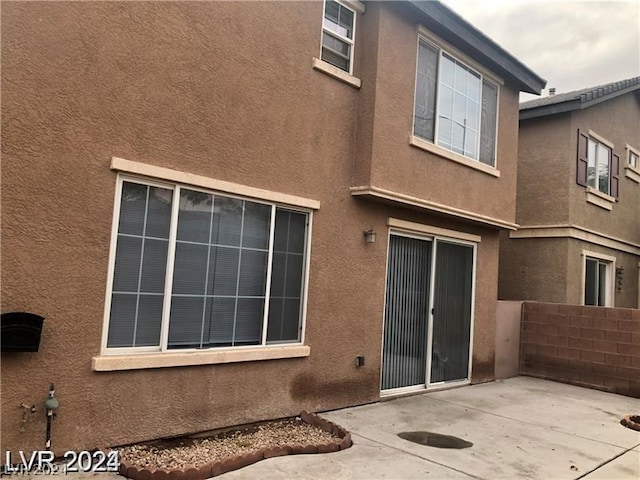 rear view of house featuring a patio area