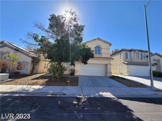 7817 Falconwing Ave, Las Vegas, NV 89131 - mediterranean / spanish-style home featuring a garage