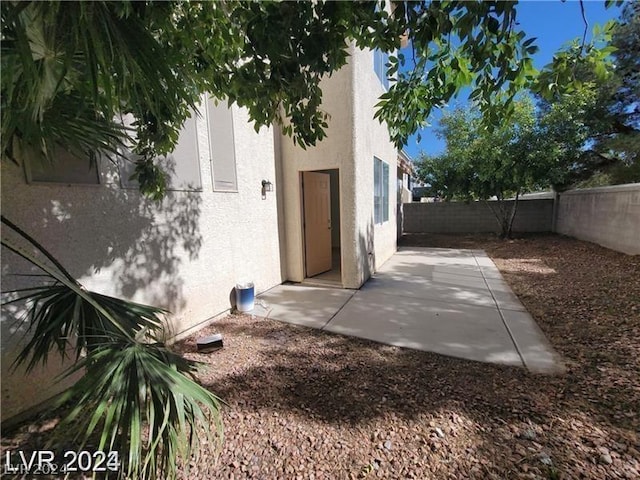 view of property exterior featuring a patio area