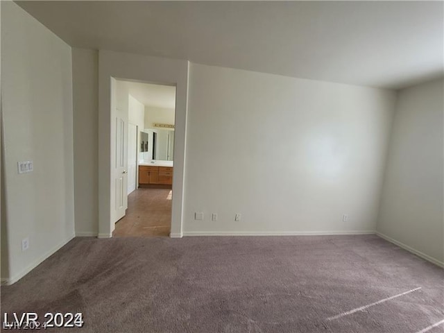 unfurnished room with carpet flooring