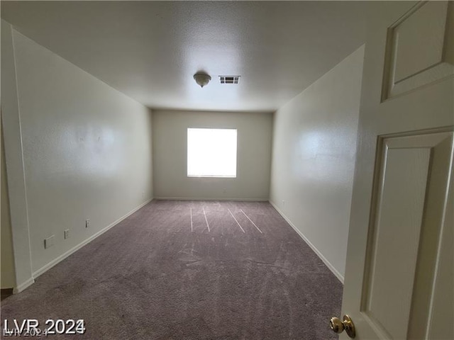 spare room featuring carpet