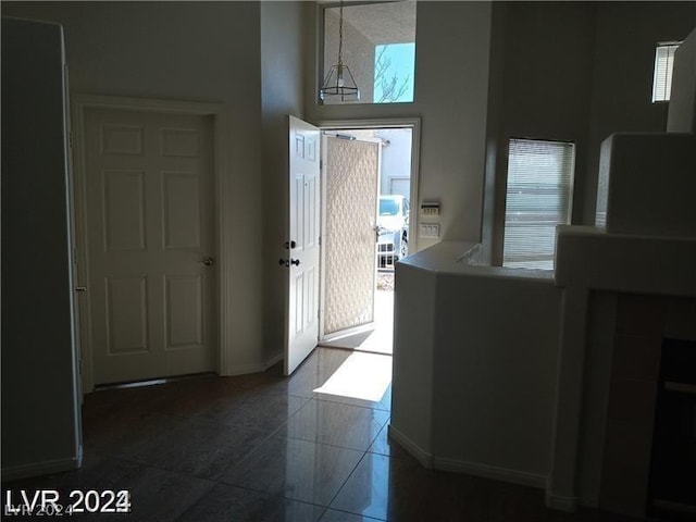 foyer with a towering ceiling and plenty of natural light