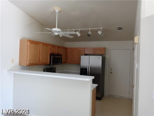 kitchen with stainless steel refrigerator with ice dispenser, ceiling fan, vaulted ceiling, and kitchen peninsula