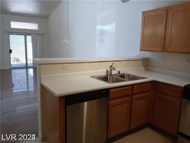 kitchen with stainless steel dishwasher, kitchen peninsula, hanging light fixtures, and sink