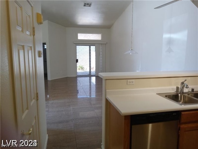 kitchen with decorative light fixtures, dishwasher, and sink