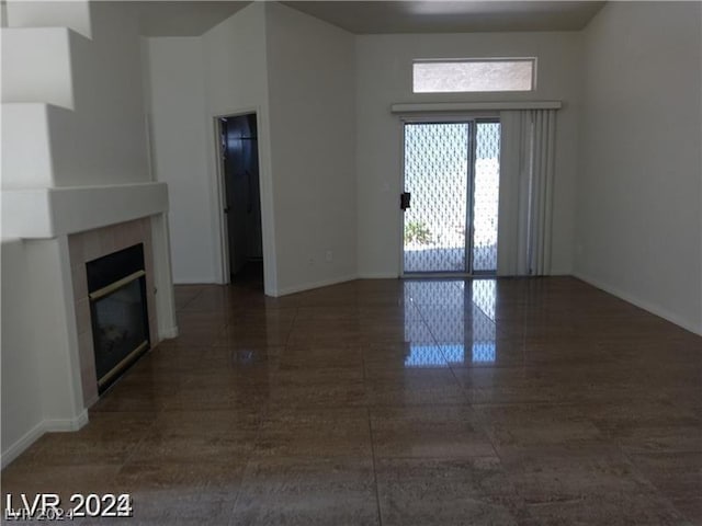 unfurnished living room featuring a fireplace