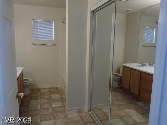 bathroom with toilet and vanity