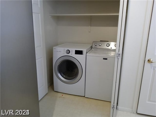 washroom featuring washer and dryer