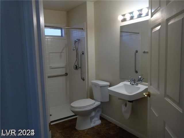 bathroom with a shower and toilet