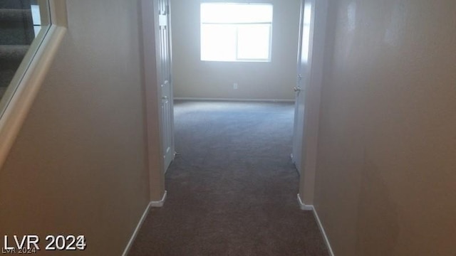 corridor with dark carpet