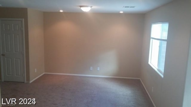 unfurnished room with carpet floors