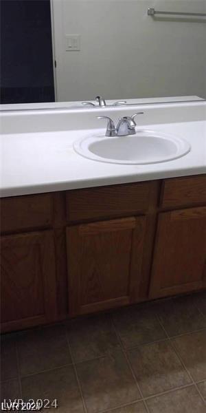 bathroom with vanity and tile patterned floors