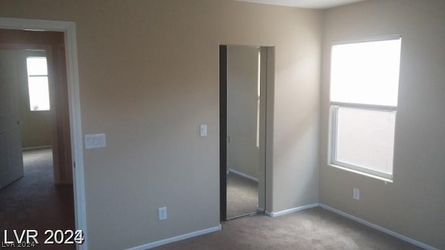 unfurnished bedroom with carpet