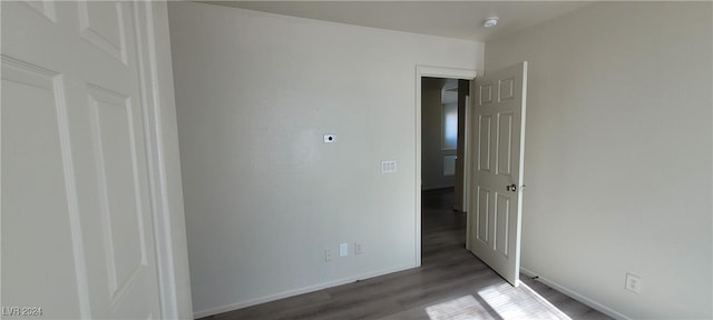 spare room featuring dark hardwood / wood-style floors