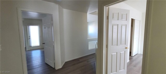 corridor featuring dark wood-type flooring