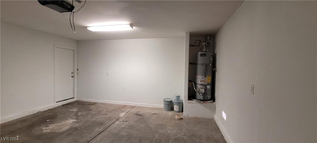 garage with a garage door opener and strapped water heater