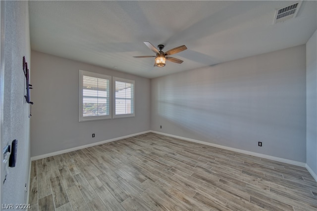 unfurnished room featuring ceiling fan and light hardwood / wood-style floors