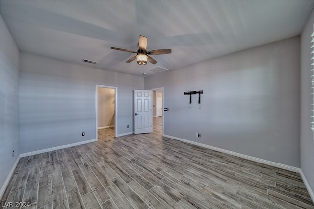 spare room with ceiling fan and light hardwood / wood-style floors