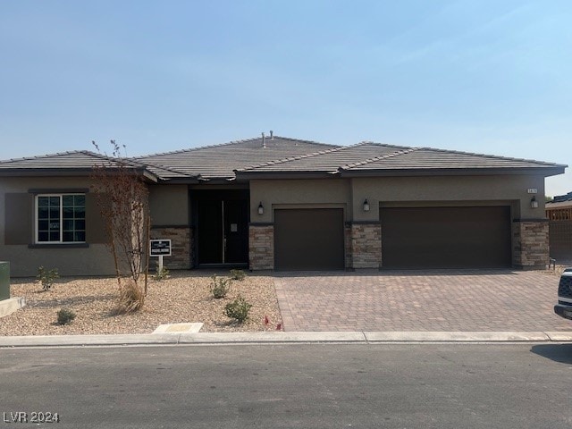 prairie-style home featuring a garage