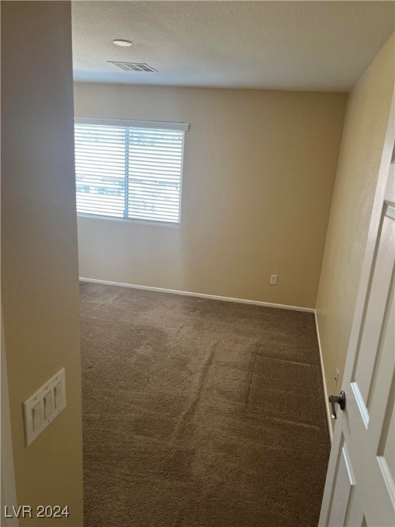 empty room featuring carpet flooring