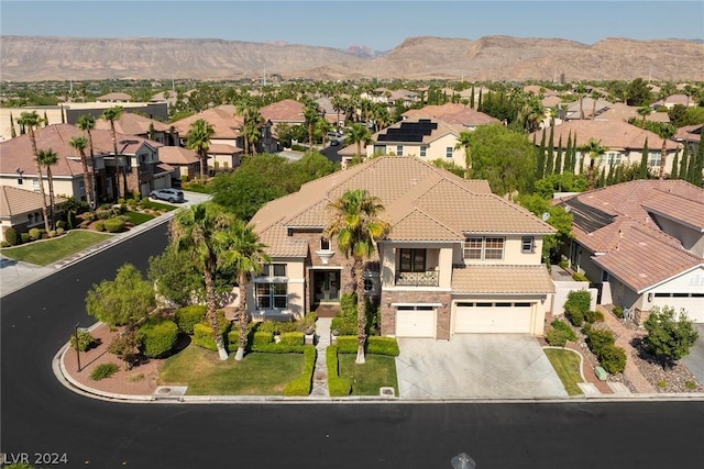 aerial view featuring a mountain view and a residential view