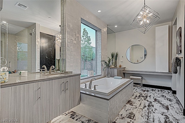 bathroom featuring tile patterned floors, vanity, and plus walk in shower