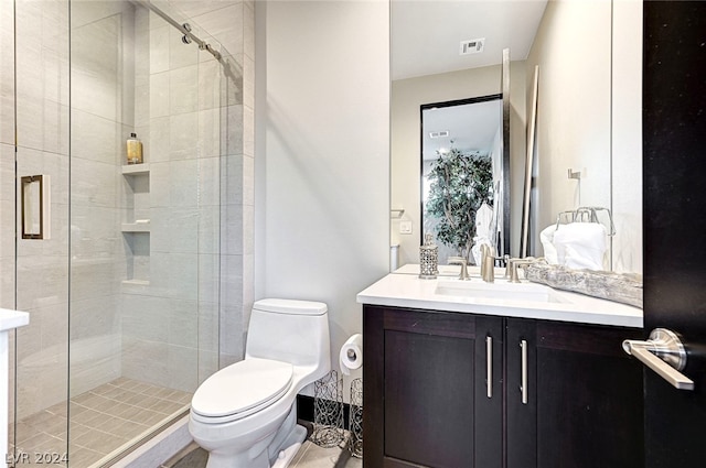 bathroom featuring walk in shower, vanity, and toilet