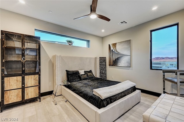 bedroom featuring ceiling fan and light wood-type flooring